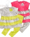 Vibrant colors and playful ruffles give this First Impressions tunic and leggings set a fun style.