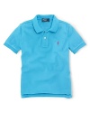 A short-sleeved polo shirt is cut in soft breathable cotton mesh.