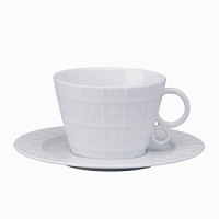 Modern in design with a raised circular pattern, made from French Limoges Porcelain. Dishwasher and microwave safe.