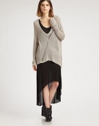 An oversized knit that doesn't lose its femininity, thanks to a creative open back and chic high-low hem.Plunging v-neckLong sleevesHigh-low hemCrossover detail on open backAbout 34 from shoulder to hem65% viscose/35% polyesterDry cleanImported of Italian fabricModel shown is 5'10 (177cm) wearing US size Small.