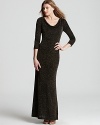 In a shimmering fabric, Adrianna Papell's long cowl neck dress makes an unforgettable exit with a scooped back.