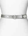 Subtle and silvery. Tory Burch's metallic skinny belt gives a fashion-forward waistline the designer treatment.