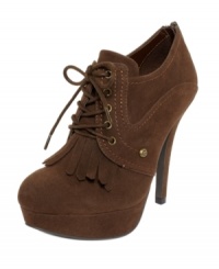 Try on a style borrowed from the boys. The Venise booties from G by GUESS incorporate a trendy kiltie detail on the toe and a heel that heats up any look.