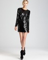 Standout in sequins with this shimmering Rachel Zoe dress with cutout back. Team with edgy booties for city chic.