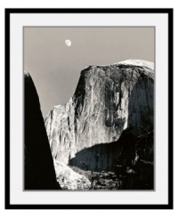 The force of Half Dome, contained in a black satin, deep profile frame. Famous for his black and white renderings of America's national parks, photographer Ansel Adams captures Yosemite's most well-known site under dramatic shadows.