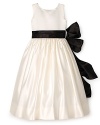 Make her day magical in this pearly Us Angels dress, featuring two sash options and a billowy princess skirt.