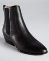 KORS Michael Kors reinvents the chelsea boot with a smart, softly pointed toe and smooth, polished leather.