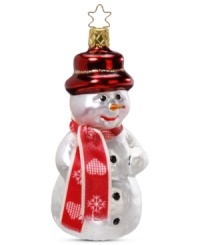 Dressed for the occasion! This Inge-Glas snowman is all decked out with a red hat and coordinating scarf, making him the coolest ornament on your Christmas tree. Mouth-blown and hand-painted.