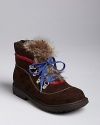 Whether she's hiking to the highlands or a few blocks to school, this cute short boot embellished with a tuft of faux fur and printed trim makes every step stylish.