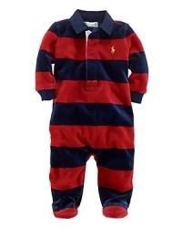 A comfortable footie in plush velour features a preppy rugby stripe and collar for a timeless sporty look.