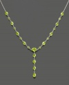 Shine bright with this gorgeous 14k white gold necklace featuring peridot (7-3/4 ct. t.w.) in round, heart and oval cuts. Approximate length: 17 inches. Approximate drop: 1-1/4 inch.