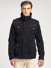 This classic outerwear silhouette exudes a mixed-media effect, structured in rich cotton with nylon accents on the collar, shoulder and elbows, finished with a logo patch near the rear hem.Zip frontStand collarChest, hip flap pocketsShoulder epaulettesAbout 29 from shoulder to hemCottonDry cleanImported