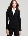 A smart, three-button silhouette lends polish to this tailored T Tahari jacket.