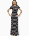 A warm-weather essential, a chic Lauren Ralph Lauren Petites striped maxi dress is crafted with short sleeves and a buttoned placket.