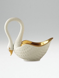 This graceful swan in white porcelain and 14kt gold accents is perfect for serving or decoration. Hand-gilded 7 edition: 3W X 7H X 6½D 13 edition: 6W X 13H X 13D Made in Portugal