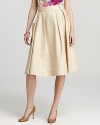 Boasting generous pleats and a modest silhouette, this kate spade new york skirt embraces this season's flair for classic feminine style. Polished pumps lend a sophisticated finish.