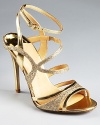 A sparkling sandal from IVANKA TRUMP: the Hailey, glittering in gold, lends radiant style to glamorous evenings.