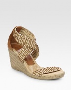 Woven straw and leather straps grounded by an espadrille wedge and comfortable rubber sole. Hemp-covered wedge, 3 (75mm)Hemp-covered platform, ½ (15mm)Compares to a 2½ heel (65mm)Leather and straw upperLeather and straw liningRubber soleImportedOUR FIT MODEL RECOMMENDS ordering true size. 