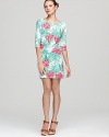 Painterly florals bloom against an effortless Lilly Pulitzer shift dress for flawless femininity. Freshen the silhouette with a dash of sparkle and strappy sandals.