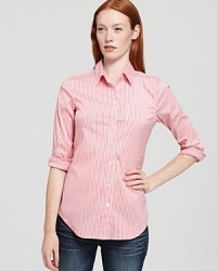 A tailored essential with slim, sophisticated stripes, this button-down Theory shirt, is a timeless wear-to-work look that moonlights on weekends with denim.