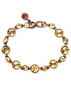 Shine like the sun. Givenchy's flex bracelet is crafted from brown gold-tone mixed metal. Light Colorado topaz accents add sparkle. Approximate length: 7-3/8 inches.