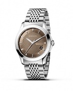 A stainless steel watch from the Gucci G-Timeless collection. Round brown dial with pattern and stick hour indices. Sweep second hand and date window.