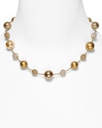 Carolee's necklace with alternating plain and pave beads lends a chic, sparkling finish to your look.