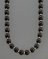 A dramatic and striking necklace featuring onyx beads (8 mm) separated by polished 14k gold beads. Length measures 30 inches.