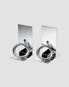 From the Vertigo Collection. Signature rings reflect in the polished silverplating of a weighted, stunning touch to a bookshelf, table or mantel. Set of two Each, 5½ high Imported