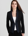 Inspired by a men's tuxedo and revamped for an extra-feminine look, this haute little Edun jacket flaunts a refined single-button front with a lustrous contrast lapel and unexpected leather trim.