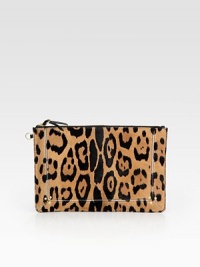 A smooth leather zipper accent is the perfect finishing touch on this ultra-chic compact shape of leopard-printed pony hair. Top zip closure with leather pullCotton lining11½W X 7½H X ½DImported