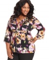 Flaunt feminine frills with NY Collection's three-quarter-sleeve plus size blouse, accented by a floral-print and ruffles.