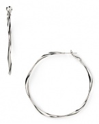 Delicately twisted, this pair of metal hoop earrings from Aqua is a sophisticated take on a classic style. Make them part of your 24/7 collection to add a simple, silvery touch to every look.