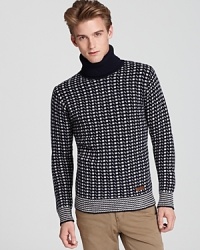 Undeniably handsome, this patterned turtleneck rocks the ski slopes and afterward too when you're warming yourself in front of the fire. Another distinctive design from the always brilliant Burberry Brit.