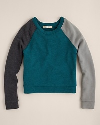 The raglan sleeves and the complimentary colorblock pattern adds warmth to this 80s-inspired pullover from ALTERNATIVE.