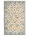 Attractive floral images make this country-style rug a delightful addition to any room. Woven from plush wool, the Country Heritage rug features a muted yellow field, speckled with beautiful blues and whites.