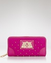 The perfect mix of glamour and on-duty functionality, this Juicy Couture wallet is dressed up in coolly quilted nylon with a smattering of studs.