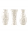 Spread elegance throughout your home with Opal Innocence Carved vases, featuring classic silhouettes with an embossed vine motif in shiny white porcelain. A pretty showcase for a couple of blooms.