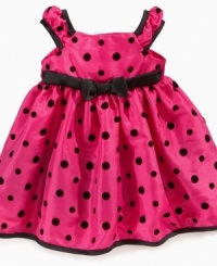 Polka dots sweeten up her party-time look with this precious dress from Penelope Mack.