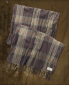 A lightweight, fringed scarf in plaid woven cotton gives a rugged finishing touch to any look.