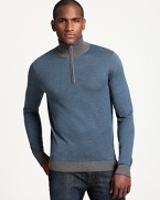 Casual style goes luxe in a mockneck teal sweater from BOSS Black. A half-zip neckline and contrasting collar and cuffs add a sporty accent.