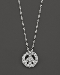 From the Tiny Treasures collection, a diamond peace sign necklace; with signature ruby accent. Designed by Roberto Coin.