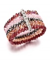 Nothing says femininity like pretty pink hues and a touch of sparkle. This romantic cuff by Ali Khan features five rows of sparkling pink glass beads with a row of rhinestone accents. Bracelet stretches to fit wrist. Approximate diameter: 2 inches.