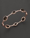 From the Rosé collection, eight smoky quartz stations on a hammered bangle. Designed by Ippolita.