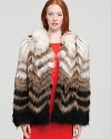 A classic Theory fur coat gets a modern makeover with the addition of chevron stripes in this bold new look for winter.