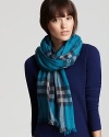 In a turquoise and navy Burberry check, this oblong scarf offers lightweight luxe with its sheer, gauzy fabrication.