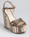 Olive-hued and snakeskin embossed leather pair together beautifully on KORS Michael Kors' Jacinda wedges, a standout style with serious height.