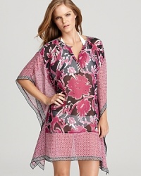 In breezy gauzy silk with a retro-inspired print, this kimono-style caftan beach coverup will certainly keep you covered in the fashion department; by Tory Burch.