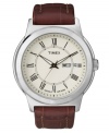 Complete a polished look with this handsome dress watch by Timex. Brown croc-embossed leather strap and round silver tone mixed metal case. Ivory dial features black Roman numerals at markers, printed minute track, day and date window at three o'clock, luminous hands, and logo. Quartz movement. Water resistant to 50 meters. One-year limited warranty.