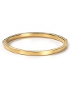 Keep it simple: MICHAEL Michael Kors' gilded bangle perfects refined polish at your wrist. Worn solo or stacked, the slim bracelet shines on for perennial chic.